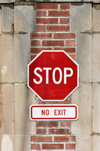 Stop No Exit Sign On Post Of A Public Parking Lot.