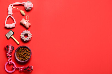 Wall Mural - Different pet care accessories and bowl of dry food on red background