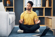 Meditation, laptop and a yoga man with an online video for mental health, wellness or zen in his home. Fitness, internet and virtual class with a male yogi in the living room to meditate for peace