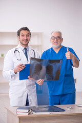 Wall Mural - Two male doctors radiologists working in the clinic