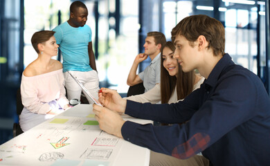 Wall Mural - Group of young business people and designers.They working on new project.Startup concept