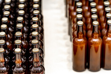 glass bottles with beer in the warehouse of the brewery