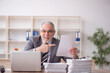 © Elnur - Old male employee and too much work in the office