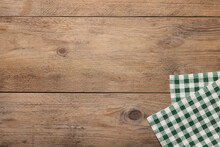 Checkered Tablecloth On Wooden Table, Top View. Space For Text