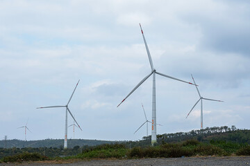 Wall Mural - Wind generator turbines at wind farm. Alternative energy concept.
