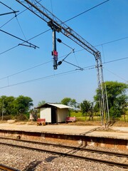 Catenary wires suspended above the tracks form a network of systems that supply electricity to vehicles powered by electric motors