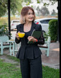 © Kanokwan - Beautiful business freelance woman standing  the gardens at home hand holding coffee cup,holding tablap and smileing ,Lifestyle relax and chill concept on holiday.