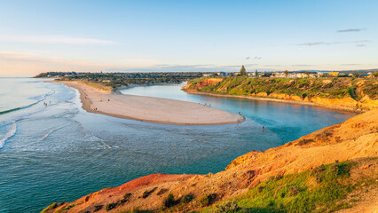 Wall Mural - Serene view of the Onkaparinga River mouth in South Port at sunset, Port Noarlunga, South Australia