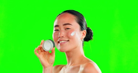 Poster - Skincare, face and woman with cream container on green screen in studio on background. Dermatology, cosmetics portrait and happy Asian female model with product, lotion or moisturizer for skin beauty