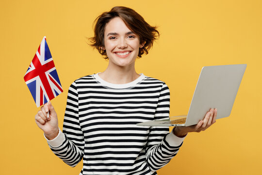young smiling happy student cheerful it woman wears casual striped shirt hold british flag use work 