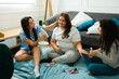 © AntonioDiaz - Happy female friends having fun at their sleepover