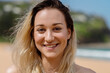 © Austockphoto - close of of smiling young woman
