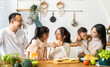 © Art_Photo - Portrait of enjoy happy love asian family father and mother with little asian girl daughter child having fun help cook food healthy eat with fresh vegetable salad and sandwich ingredient in kitchen
