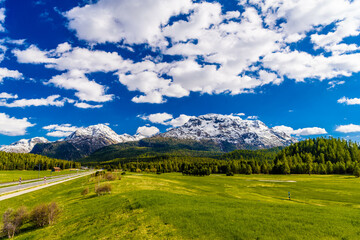 Wall Mural - Road with Alps mountains, Samedan, Maloja Graubuenden Switzerland