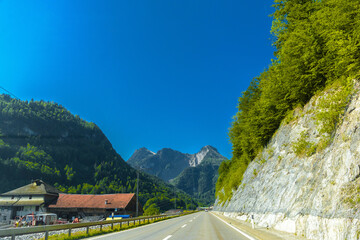 Wall Mural - Road with rocks near Haut-Intyamon, Gruyere, Fribourg Switzerland