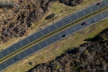 Sticker - Aerial top view of cars on the highway running through a salt marsh in Long Island