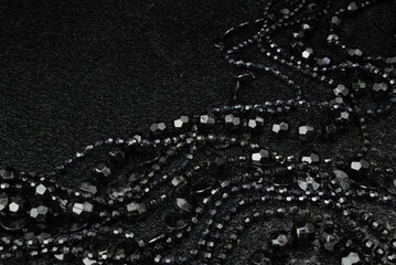 Beautiful black bead necklaces on a black background