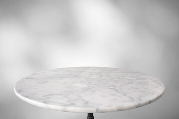 Wall Mural - Marble table with tree shadow drop on white wall background for mockup product display