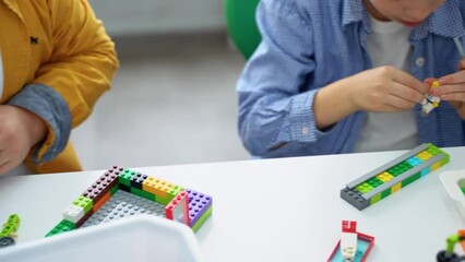 Wall Mural - robotics programming class. children construct and code robot. stem education using constructor bloc
