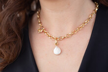 Close-up Woman Wearing Luxury Pearl Pendant And Gold Necklaces - Jewellery And Accessories Concept