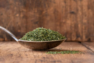 Wall Mural - Dried Dill Weed on a Vintage Spoon