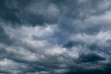 a dark blue cloudy sky. cumulus clouds. nature background. bad weather forecast. before a thundersto