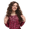 © New Africa - Beautiful young woman with long curly brown hair in pink sequin dress on white background
