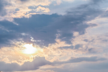 Wall Mural - cloudy sky background with sunlight through clouds