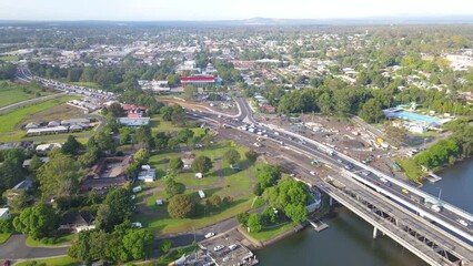 Wall Mural - Aerial drone view of Nowra at Nowra Bridge along the Princes Highway in the City of Shoalhaven, NSW, Australia with Shoalhaven River in the background 