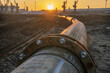 © Mike Mareen - Metal pipeline in industrial area during sunset