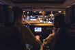 © puhimec - Man and woman in a car at night, view from the car.