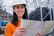 © Westend61 - Smiling young woman with map at site