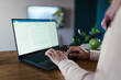 © Westend61 - Hands of freelancer typing on laptop in home office