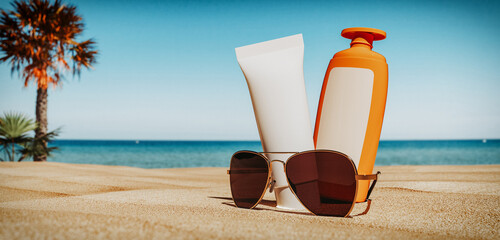 Sunglasses and sun lotion on the beach in summer