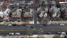 Urban Housing In America During Winter. High Aerial Truck Shot Above City Street.