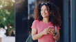 © Emil Lime/peopleimages.com - This app will help me meet new friends. a young woman using her cellphone while walking through the city.