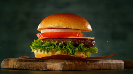 Sticker - Tasty beef burger on old wooden cutting board, close-up