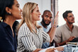 © Mikolette M/peopleimages.com - I have a question...an attractive businesswoman asking a question during a strategy meeting in the boardroom.