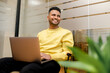 © Vadim Pastuh - Cheerful determined young bearded male student of freelancer, office worker in casual clothes, sitting in modern coworking space, typing on laptop, man is working on project, writing email to client