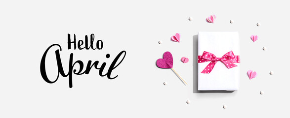 Wall Mural - Hello April message with a gift box and paper hearts