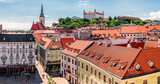 Panorama of the old town district with historical houses, St. Martin's Dome and the castle on top of the hill during a sunny day