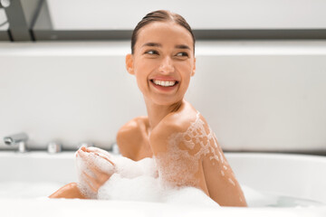 Wall Mural - Happy Lady Taking Bath Relaxing Sitting In Bathtub In Bathroom