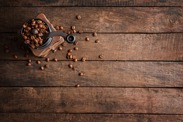 Wall Mural - Wooden background with rustic coffee gringer