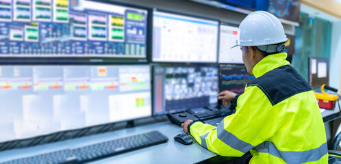 engineer working at control room,manager control system,technician man monitoring program from a lot
