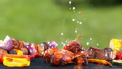 Sticker - Super slow motion of chicken legs on grill with falling spice and salt. Filmed on high speed cinema camera, 1000 fps