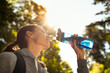 © kieferpix - Young female enjoying a refreshing drink of water