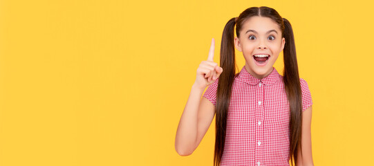 Poster - Happy girl child genius got idea pointing finger up yellow background, eureka. Child face, horizontal poster, teenager girl isolated portrait, banner with copy space.