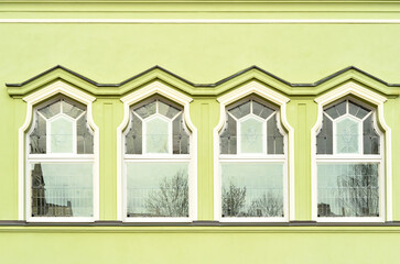 Wall Mural - view of green building with white windows