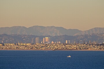 Wall Mural - Looking out over Santa Monica Bay on a very clear day with Manhattan Beach in the foreground and the skyscrapers of Century City, the Hollywood Hills and the San Gabriel Mountains in the background