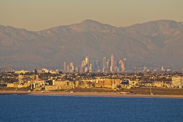 Wall Mural - On a particularly clear day, the skyline of Los Angeles, with the towering San Gabriel Mountains in the background, can be seen across Santa Monica Bay from the Palos Verdes Peninsula